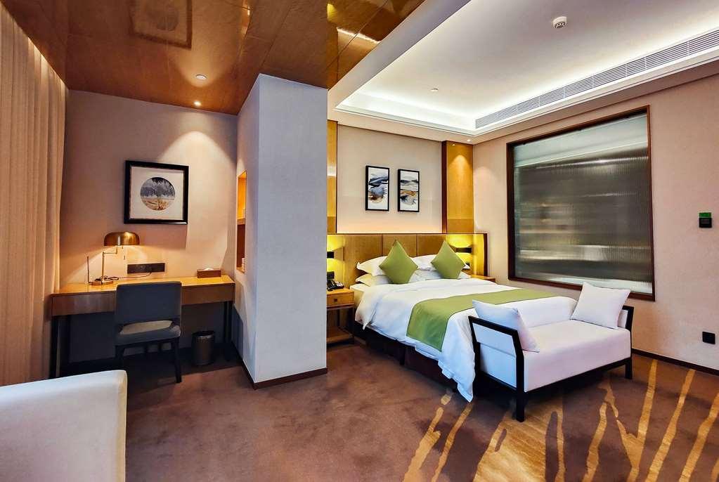 Leshan Ramada Hotel Habitación foto