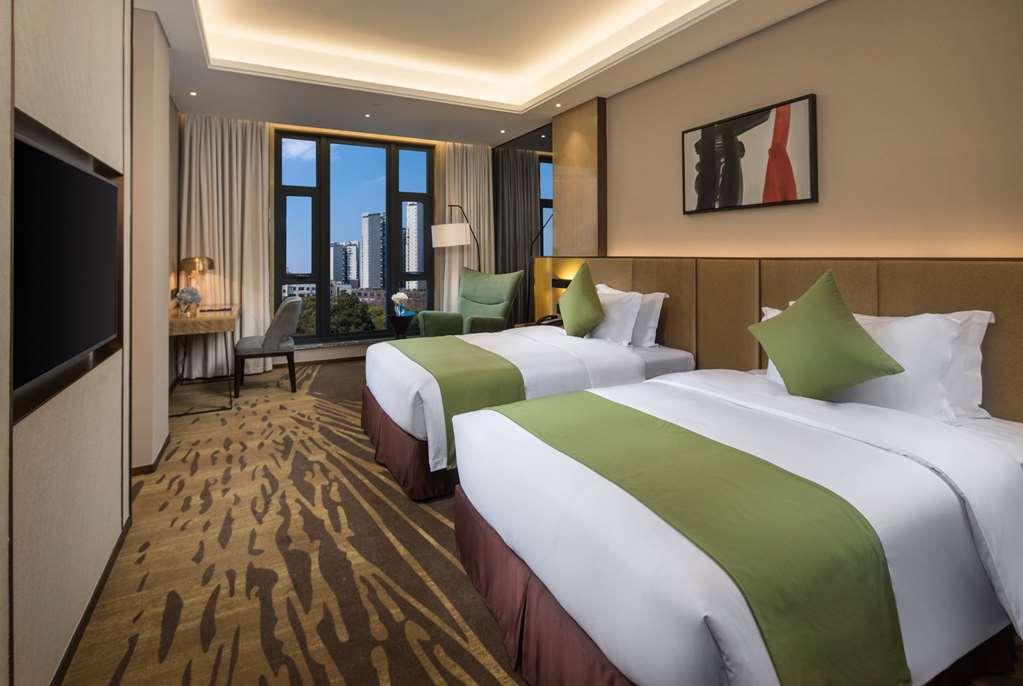 Leshan Ramada Hotel Habitación foto