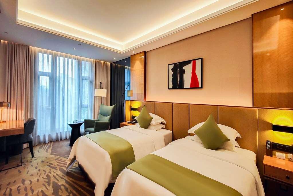 Leshan Ramada Hotel Habitación foto
